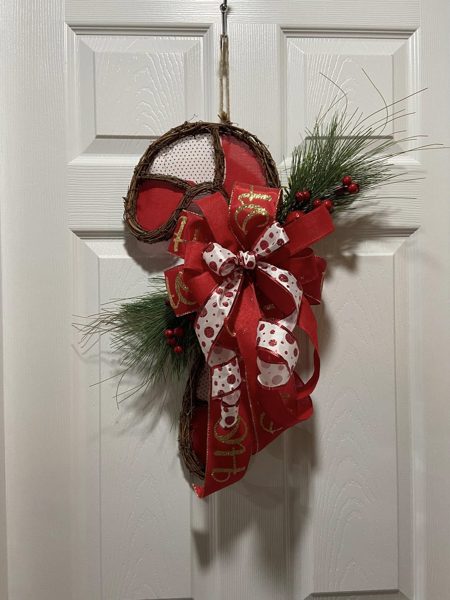 Red Christmas swag with plaid bow and pine